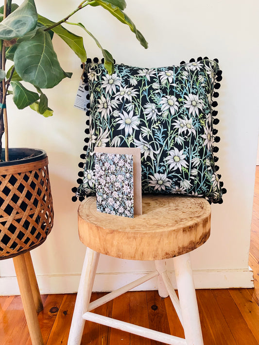 Flannel Flower Pom Pom Cushion on Black