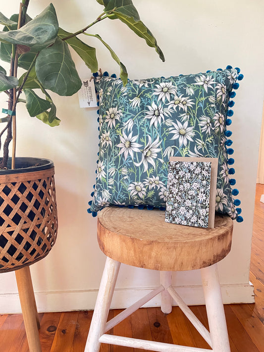 Flannel Flower Pom Pom Cushion on Teal