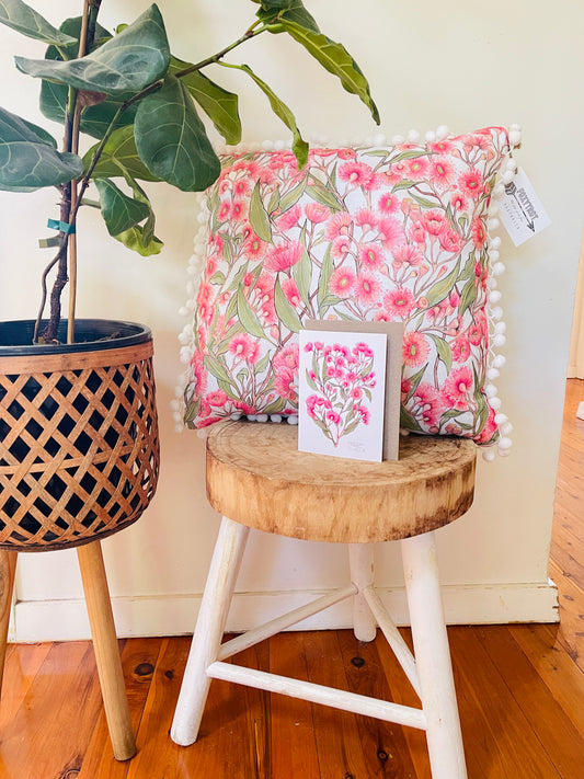 Pink Flowering Gum Pom Pom Cushion on white