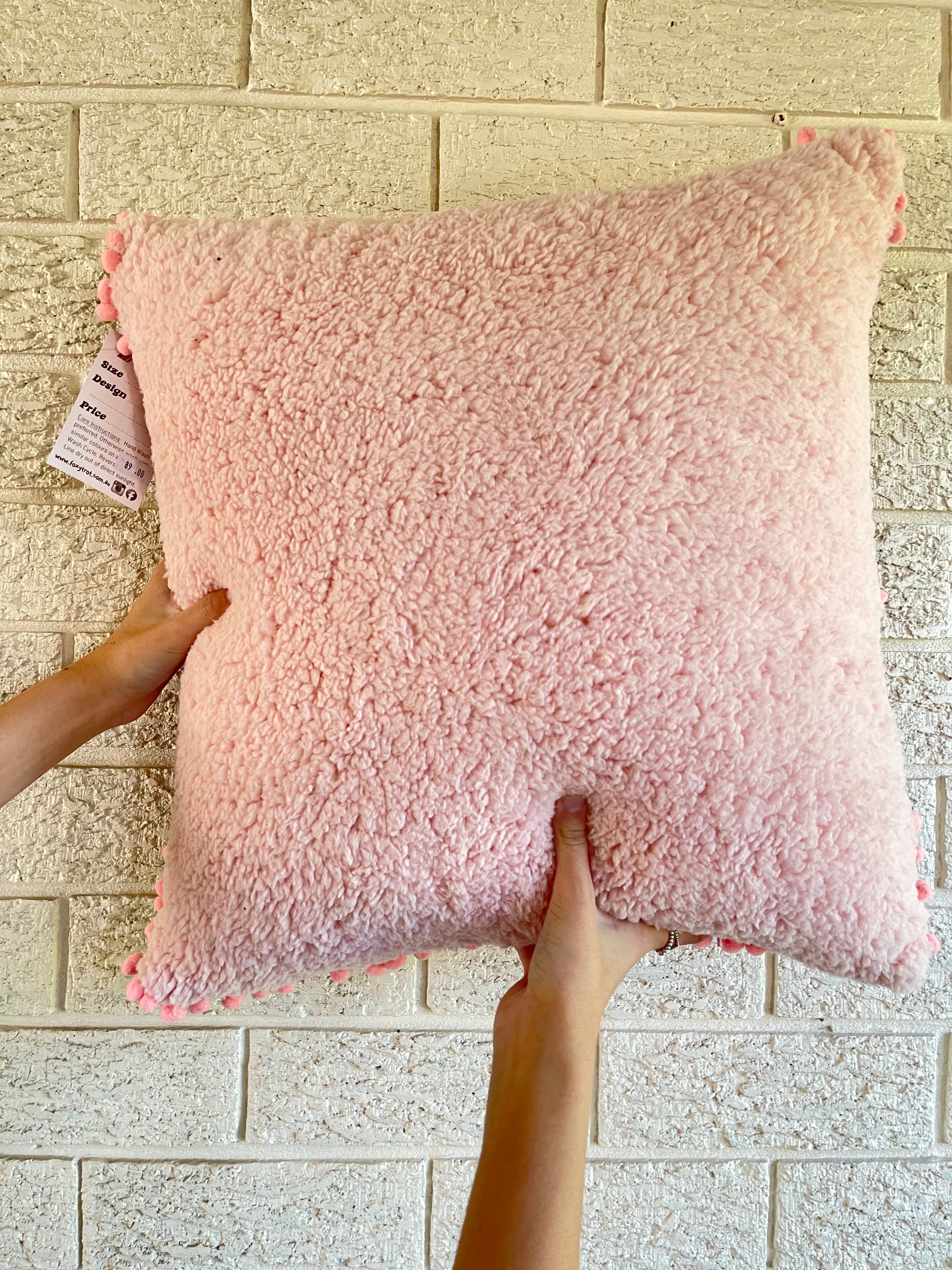 Pink Flowering Gum Pom Pom Cushion on Black