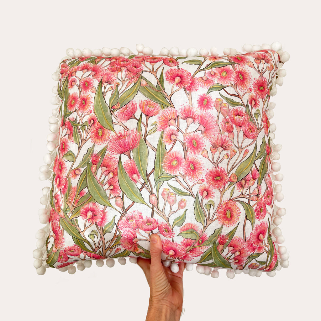 Pink Flowering Gum Pom Pom Cushion on white